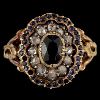 RING, 18k guld med 12 fasettslipade diamanter samt blå safirer, Gustav Dahlgren & Co, Malmö, 1939.
