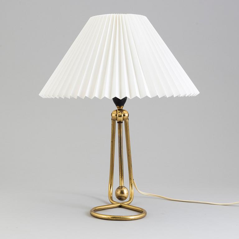 A Le Klint brass table or wall lamp.