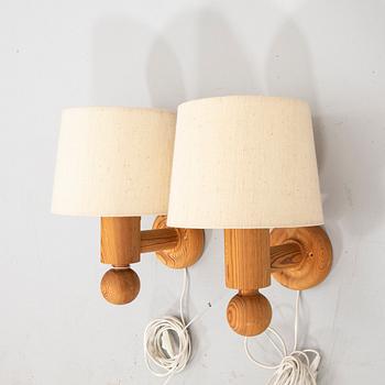 Uno & Östen Kristansson, a pair of pine wall lamps  from Luxus 1970s.