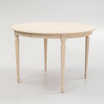 A Gustavian style dining table and eight chairs, late 20th Century.