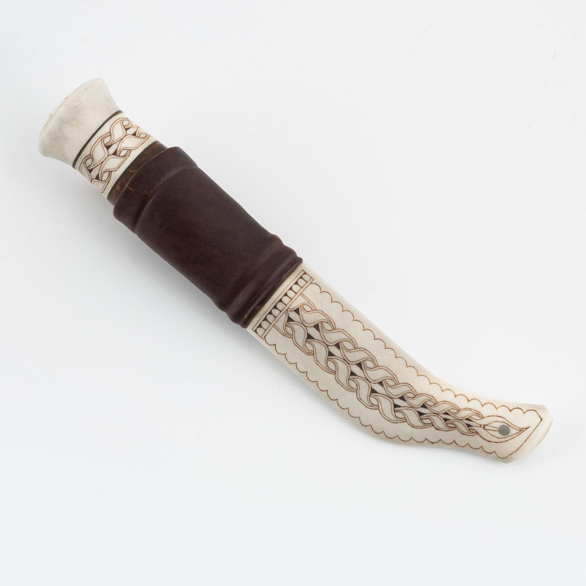 A reindeer horn knife by Bertil Fällman, signed.