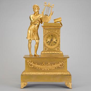 A French gilt bronze Empire mantle clock, early 19th Century.