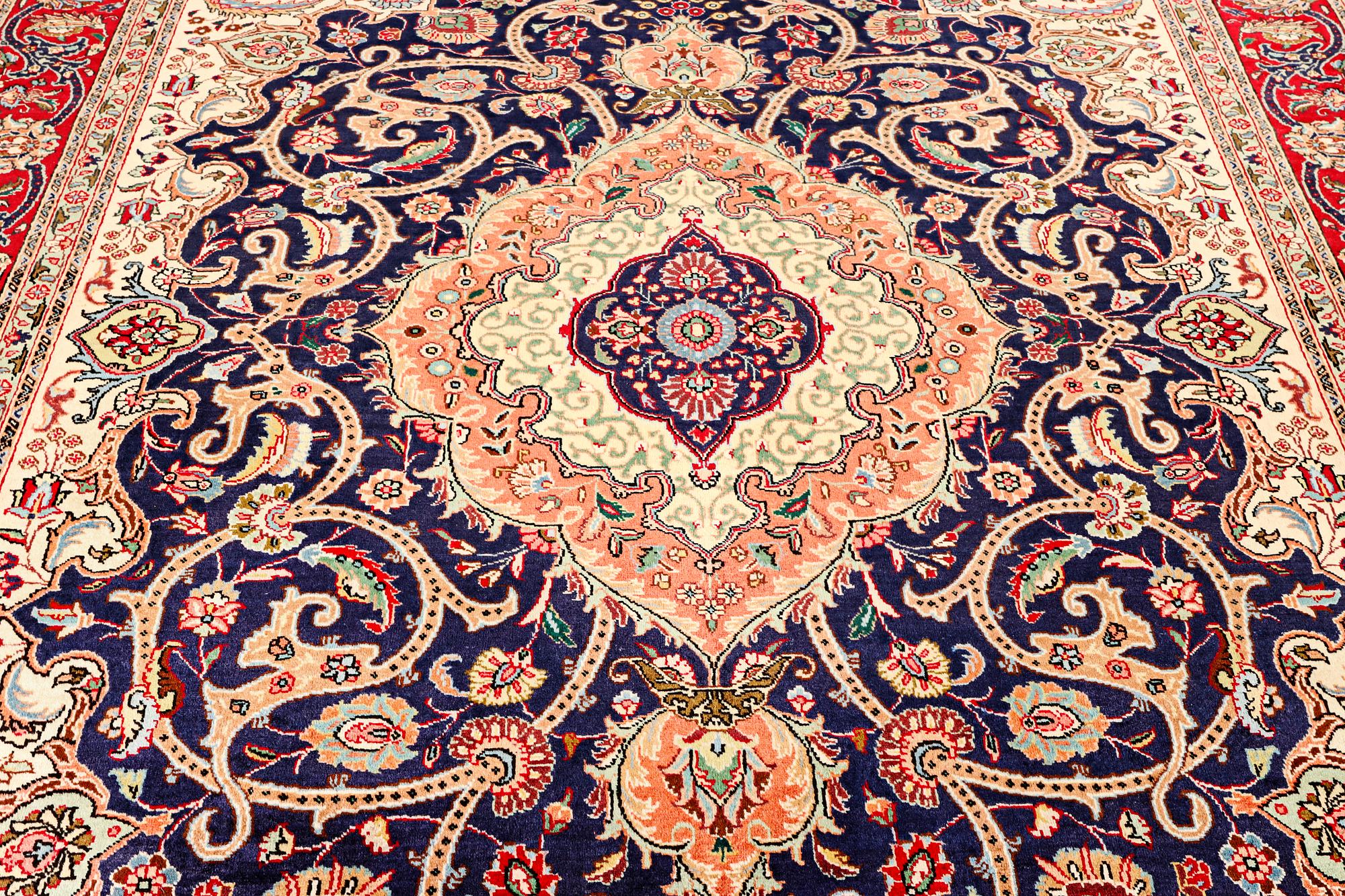 A Tabriz carpet, c. 345 x 255 cm.