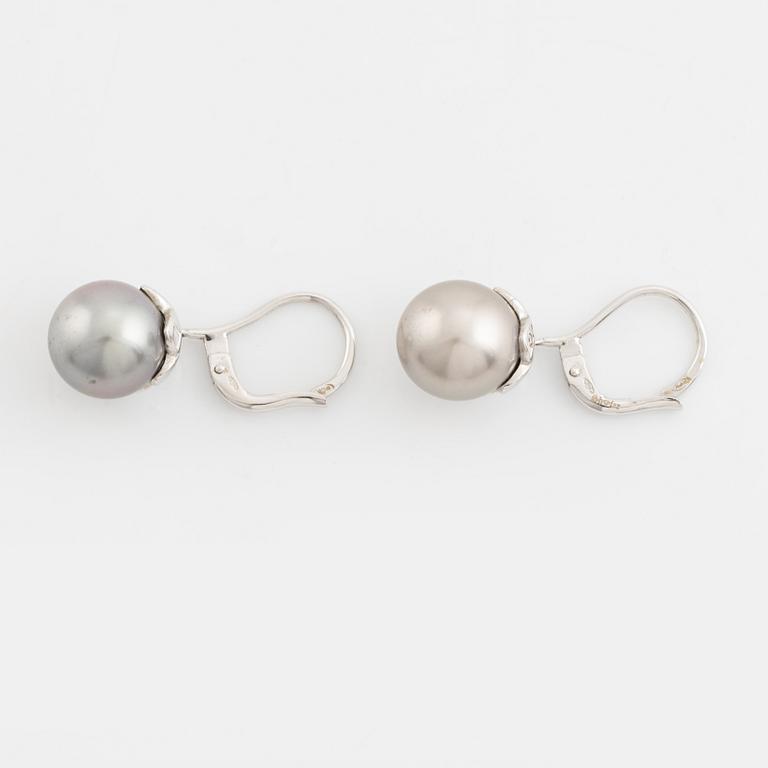 A pair of cultured pearl and brilliant cut diamond earrings.
