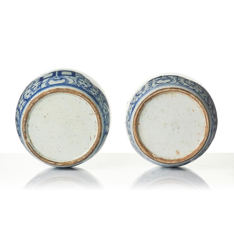 A pair of blue and white porcelain pots with covers, China, 19th century.