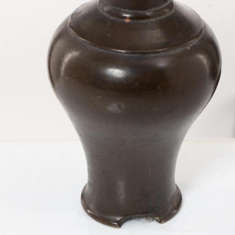 A Chinese bronze vase, joss stick holder and a bamboo brush pot, Qing dynasty.