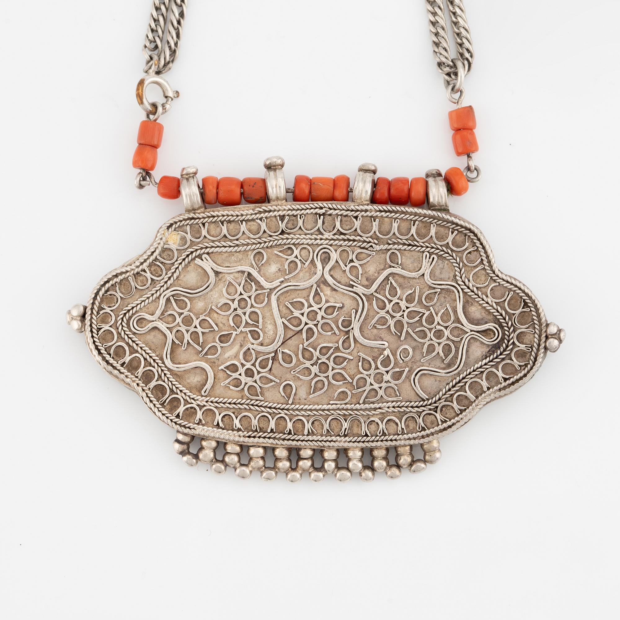 Silver and coral necklace.