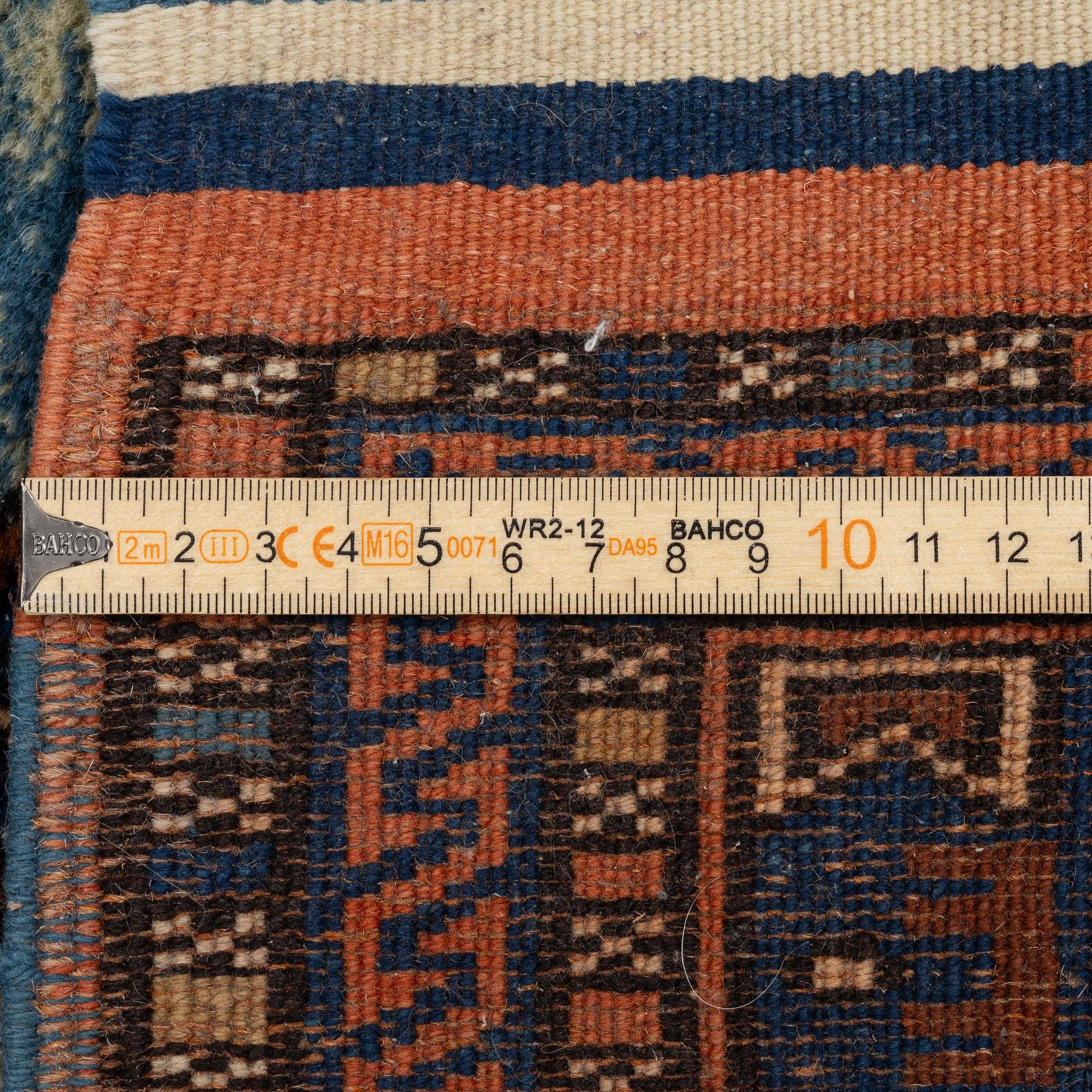 A semi-antique Anatolian rug, c. 127 x 117 cm.