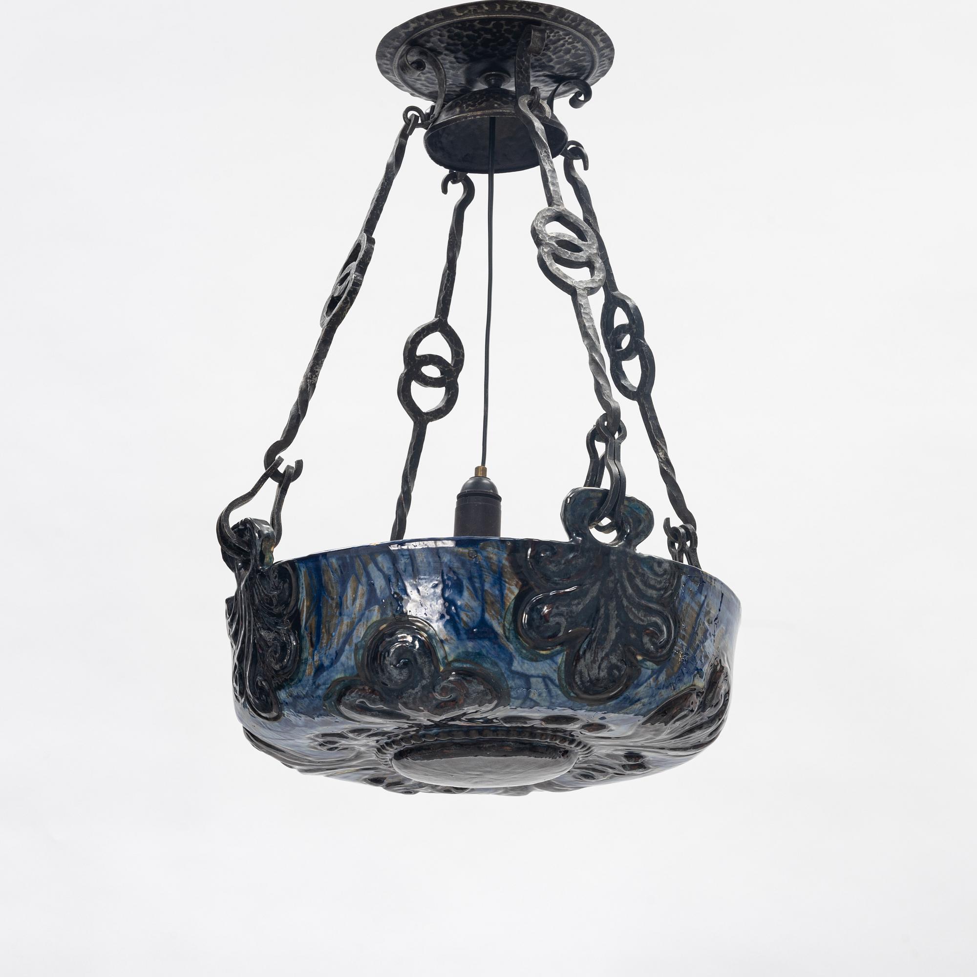 A Swedish Art Nouveau ceramic and iron ceiling light, Höganäs, early 20th century.