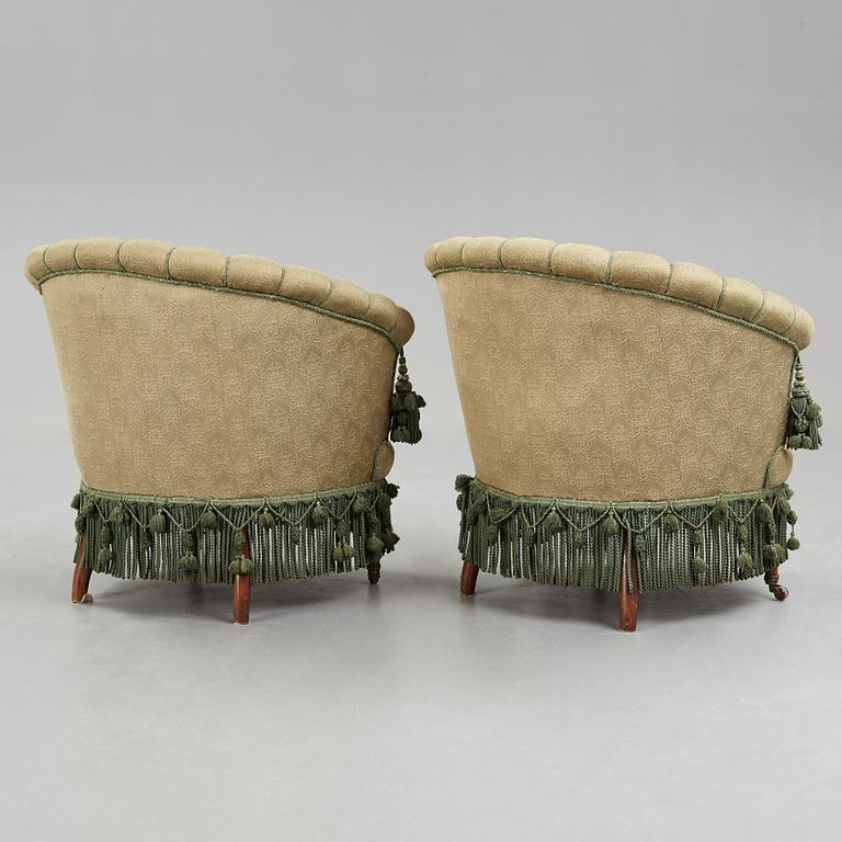 A pair of easy chairs, circa 1900.