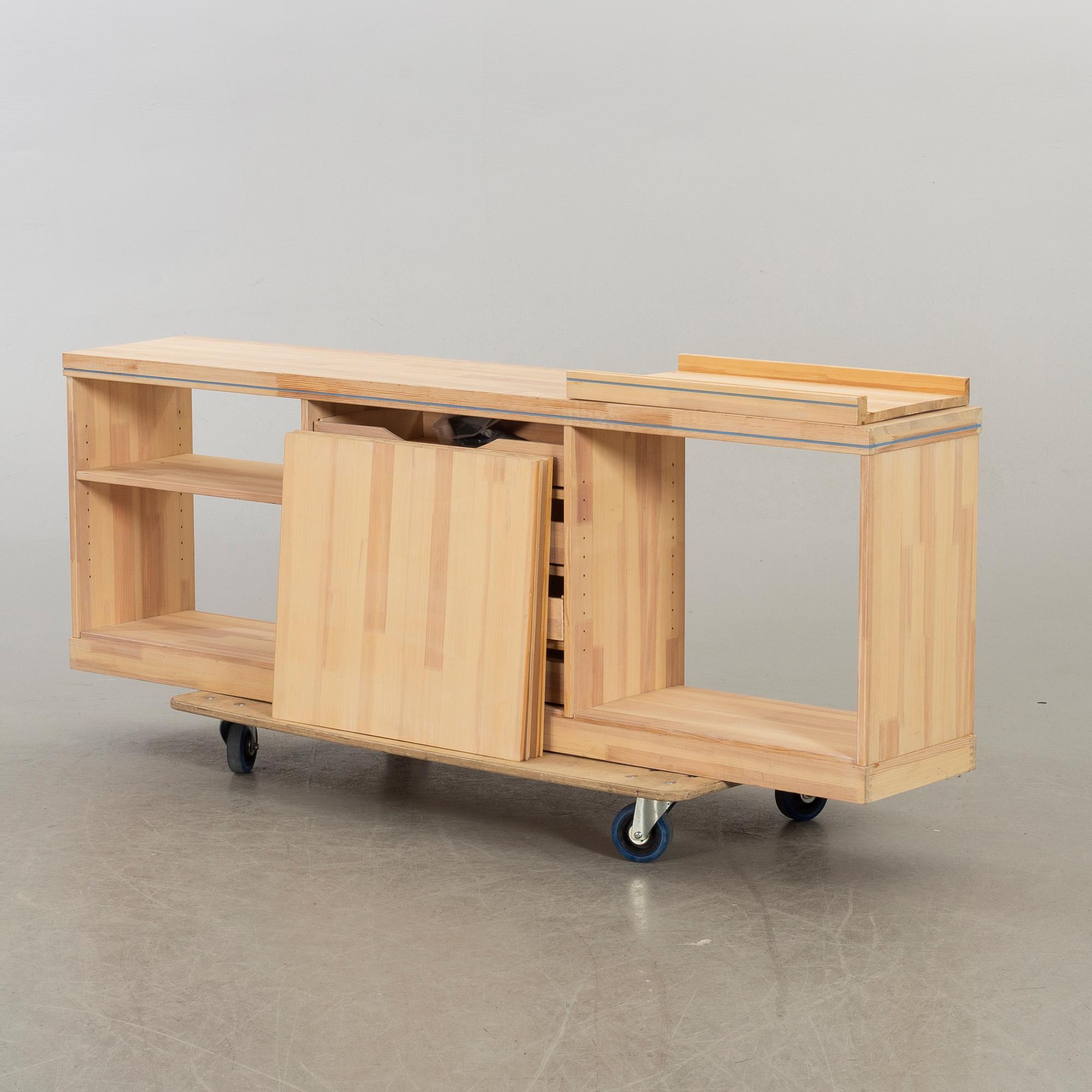 OLOF PIRA, A SIDEBOARD AND A BOOKCASE.