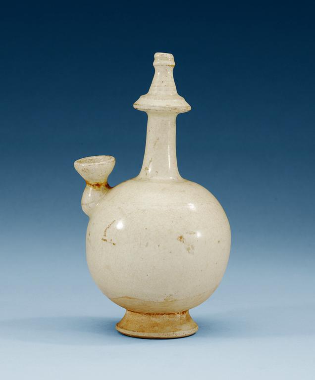 A white glazed ewer, presumably Tang dynasty.