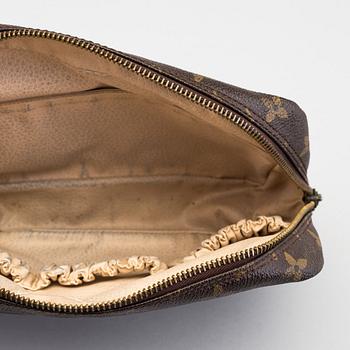 A Louis Vuitton toiletry bag.