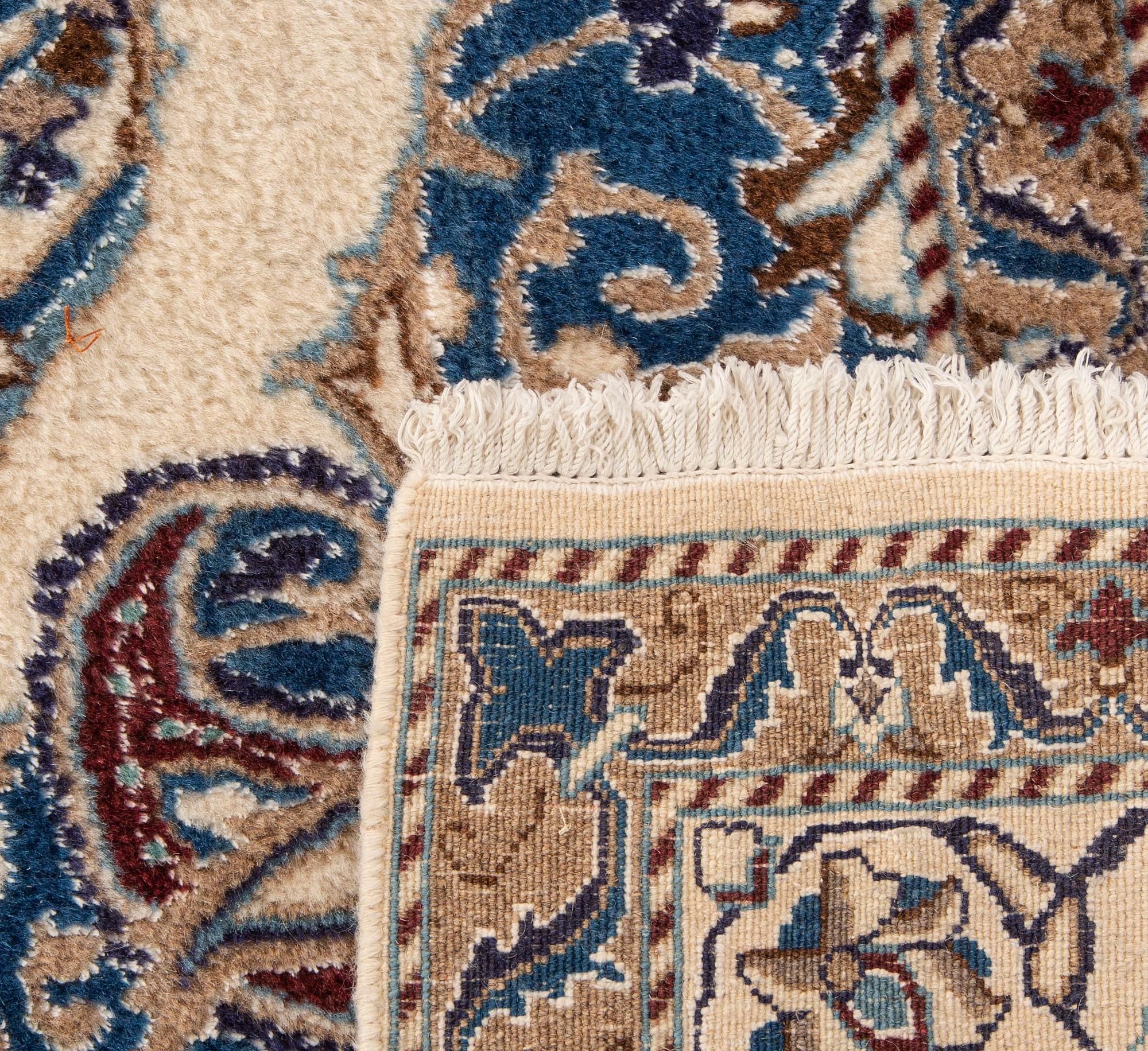 A Nain part silk carpet ca 232x160 cm.
