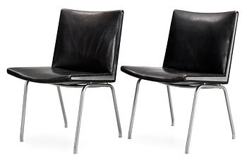 80. A pair of Hans J Wegner 'Kastrup' steel and black leather chairs, AP-stolen, Denmark.