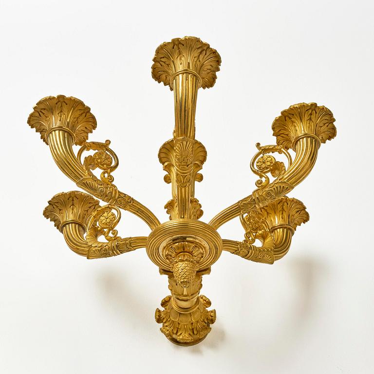 A pair of French Empire six-branch ormolu appliques, ca 1820's.