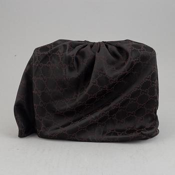 Gucci, a leather and bamboo bag.