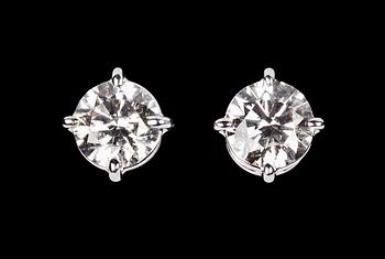 1085. A pair of brilliant cut diamond studs, 0.71 cts each.