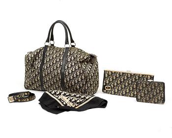 543. A monogram canvas five-piece-set consisting of a bag, belt, purse, scarf and clutch by Christian Dior.