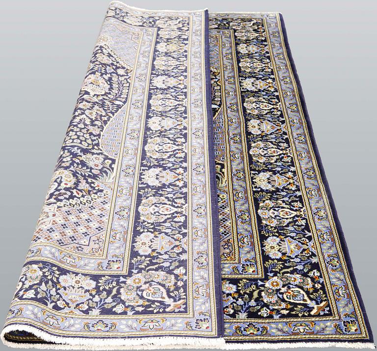 A signed part silk Kashan rug, c 210 x 140 cm.