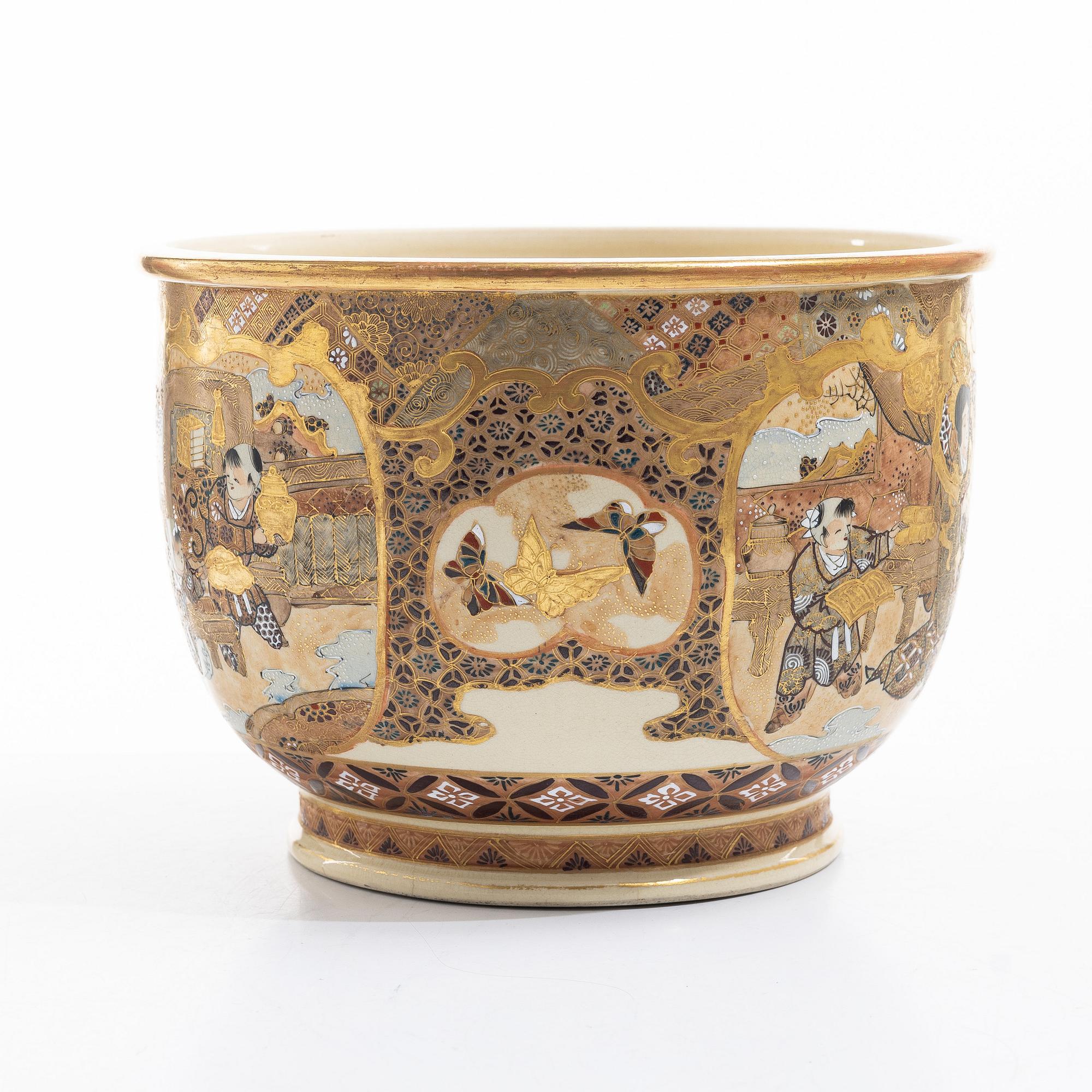 A Japanese satsuma figural flower pot, early 20th century.