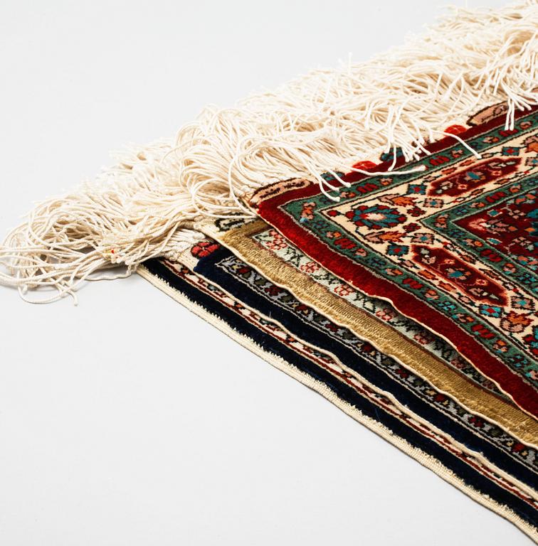 Four silk rugs/pads, probably Hereke, ca 33 x 33 cm.