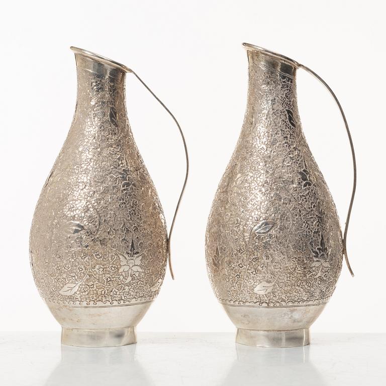 A pair of jugs, silver, Pakistan, mid-20th century.