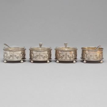 A set of four Fabergé salt-cellars and spoons, marked Moscow 1908-1917. Imperial Warrant.