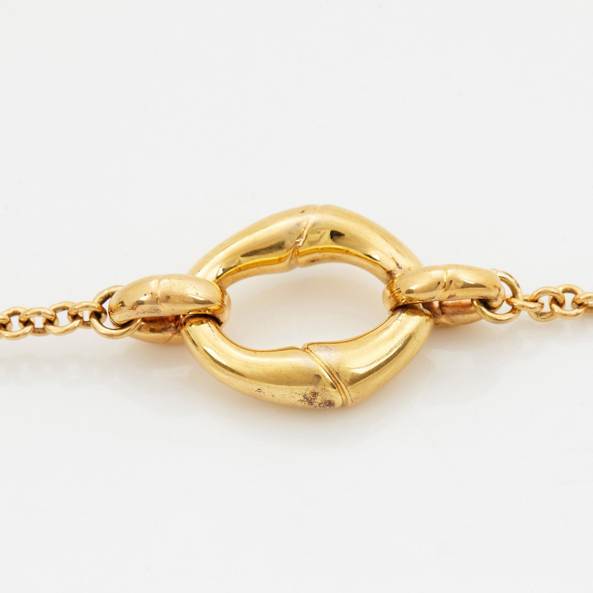 An 18K gold Gucci bracelet.