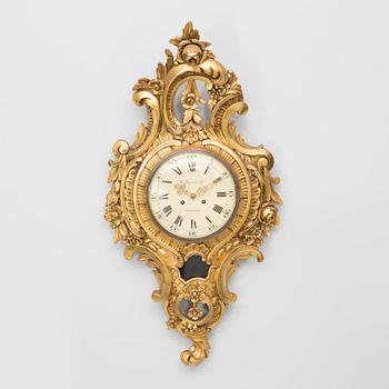 A rococo style wall clock, first half of the 20th century.