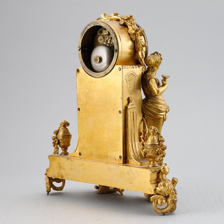 A French gilt bronze mantel clock from Henry Marc á Paris, second half of the 19th century.