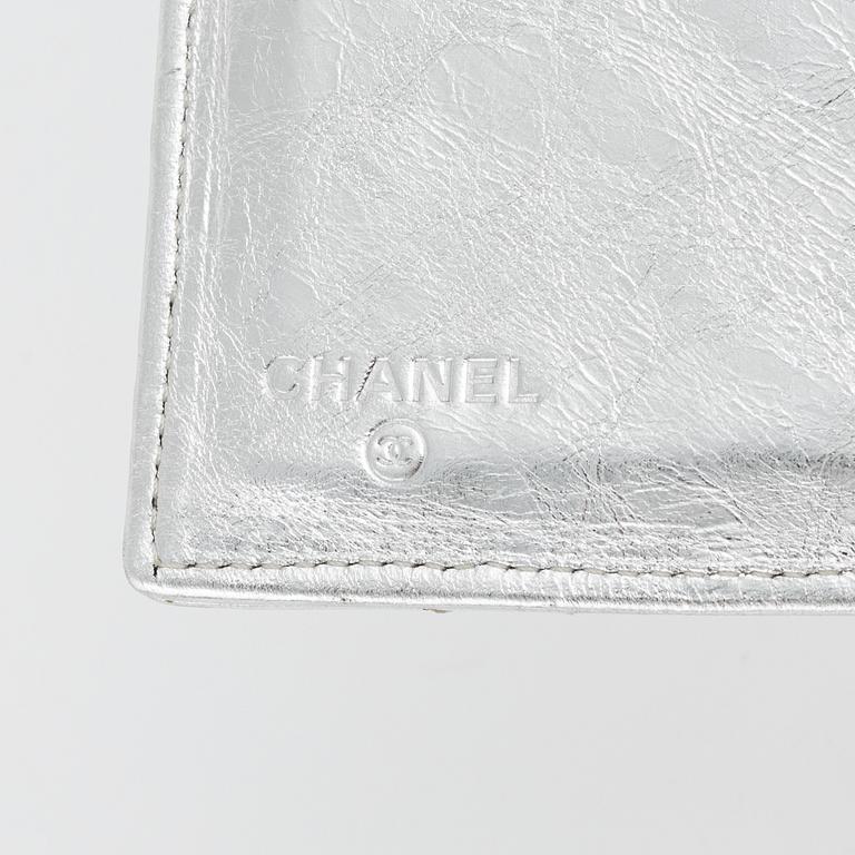 Chanel, a quilted silver leather wallet, 2006-08.