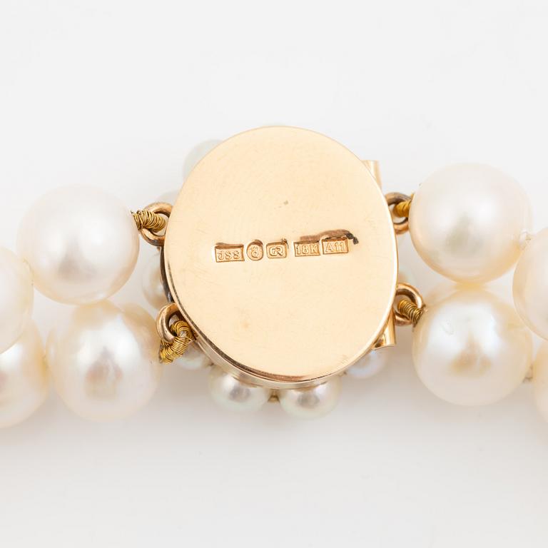 Pearl necklace, double-stranded with cultured freshwater pearls, clasp 18K gold set with aquamarine and cultured pearls, Jarl Sandin.