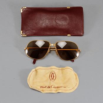 SOLGLASÖGON, Cartier.