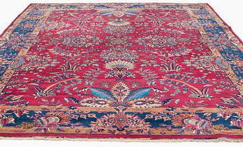 A semi-antique Mashad carpet, northeastern Persia, c. 404 x 307 cm.
