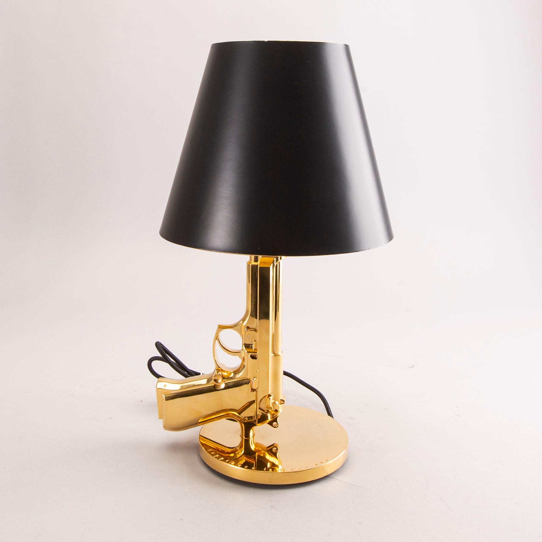 A Philippe Starck Gun bedside lamp for Flos 21st century.