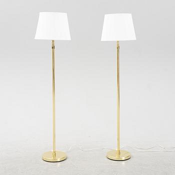 A pair of brass floor lamps, 1960's/70's.