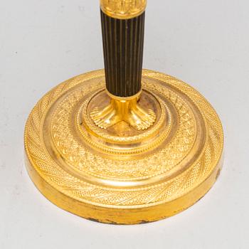 A pair of French Empire candlesticks, early 19th century.