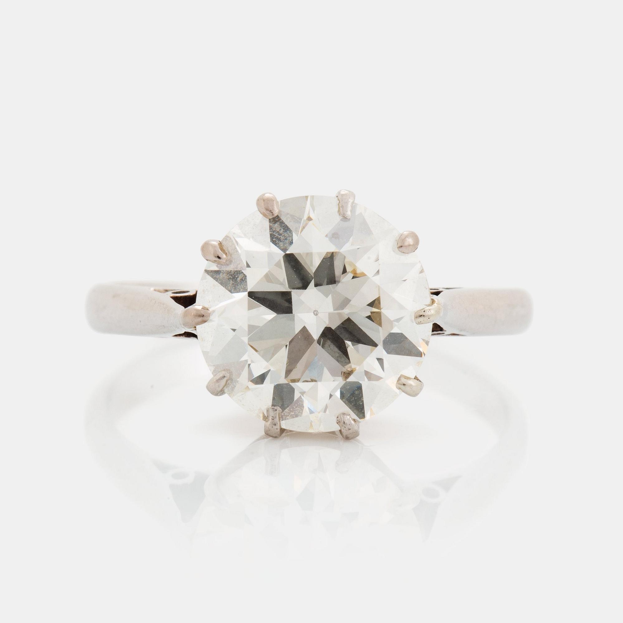 A platinum ring set with an old-cut diamond ca 3.30 cts quality ca J/K vs.