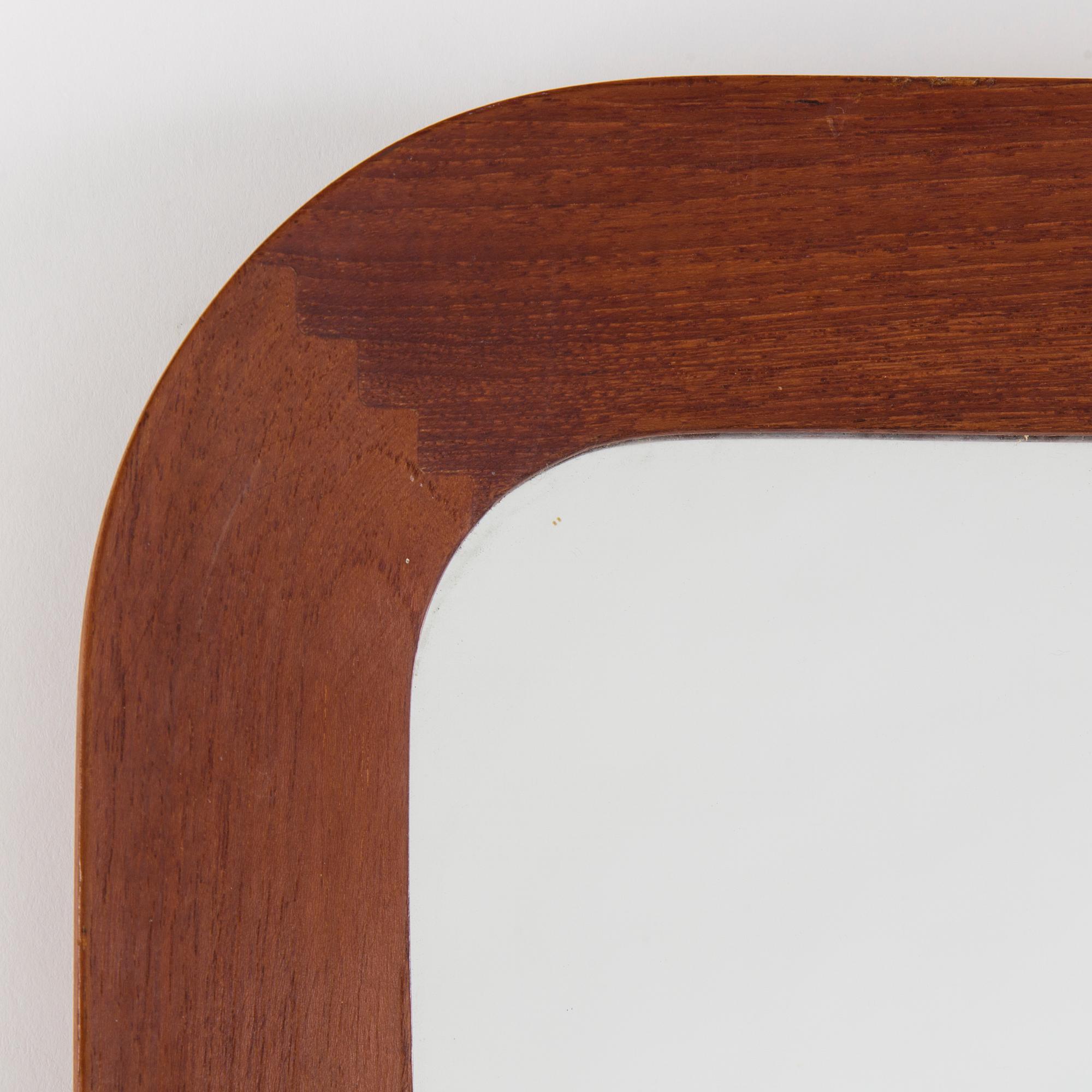 A mid 20th century mirror by G&T.