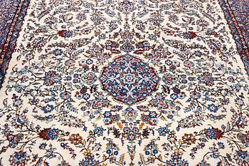 An oriental carpet with a Kerman pattern, c. 308 x 220 cm.