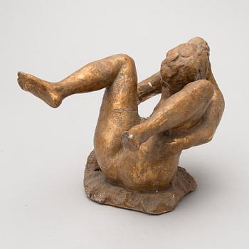 A gilt terracotta sculpture signed Matti Haupt.