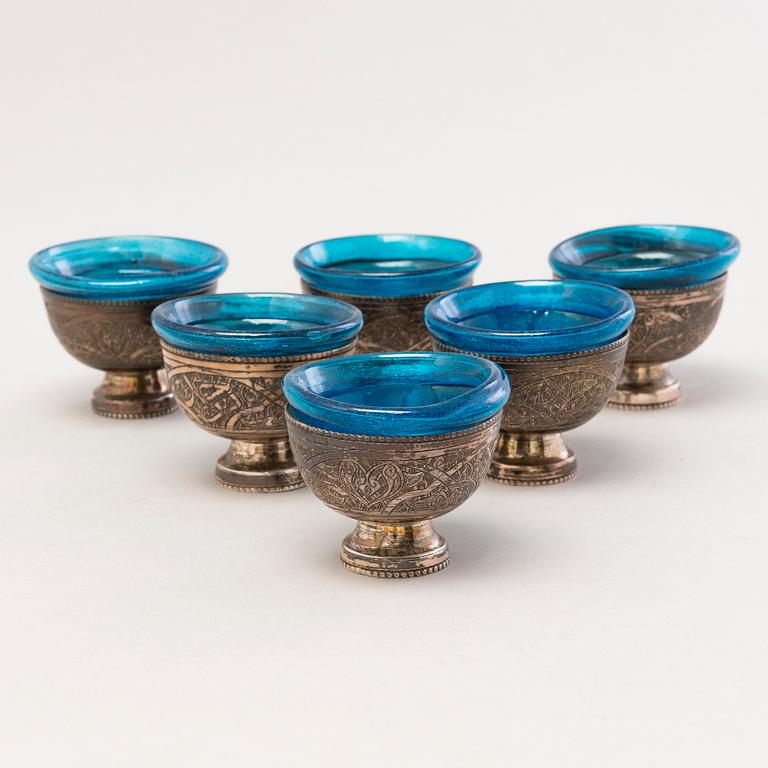 A 1970s Egyptian coffee set in silver and glass.