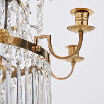 A late Gustavian gilt brass and cut glass eight-branch chandelier, Stockholm, late 18th century.