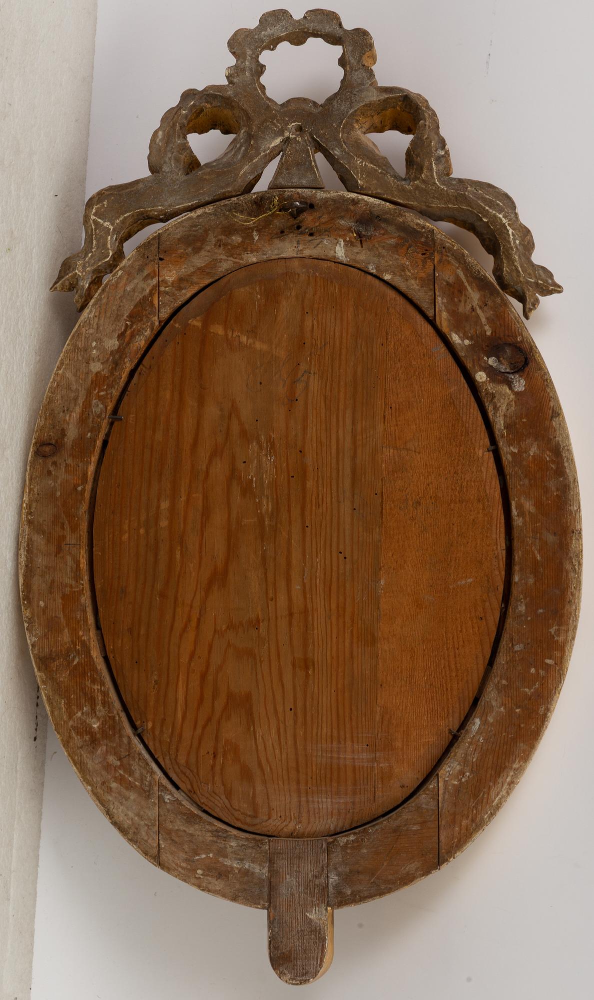 A pair of late Gustavian one-branch giltwood girandole mirrors, Stockholm, circa 1800.