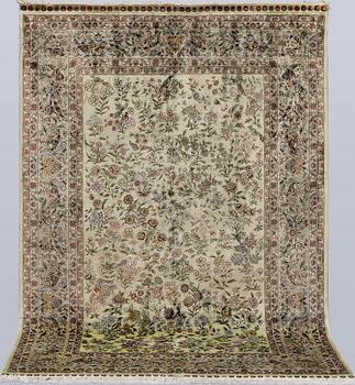A oriental silk rug, 183 x 129 cm.