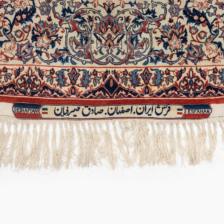 A semi-antique Isfahan rug, signed (Sadegh) Seirafian, c. 244 x 149 cm.