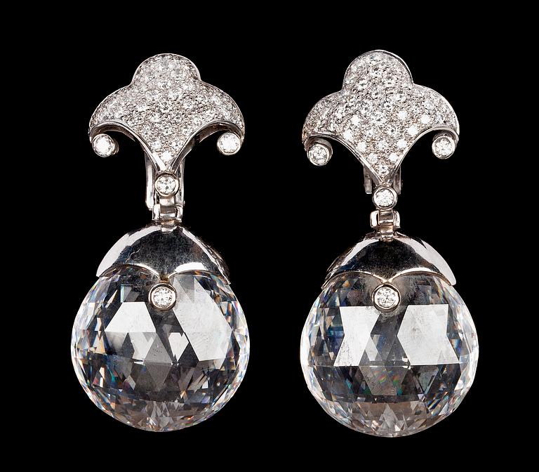 A pair of faceted rock crystal and diamond earrings, tot. app. 2.60 cts, by Lisen Stibeck.
