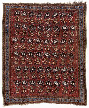 An oriental rug, semi antique, probably Baluch, c. 210 x 170 cm.