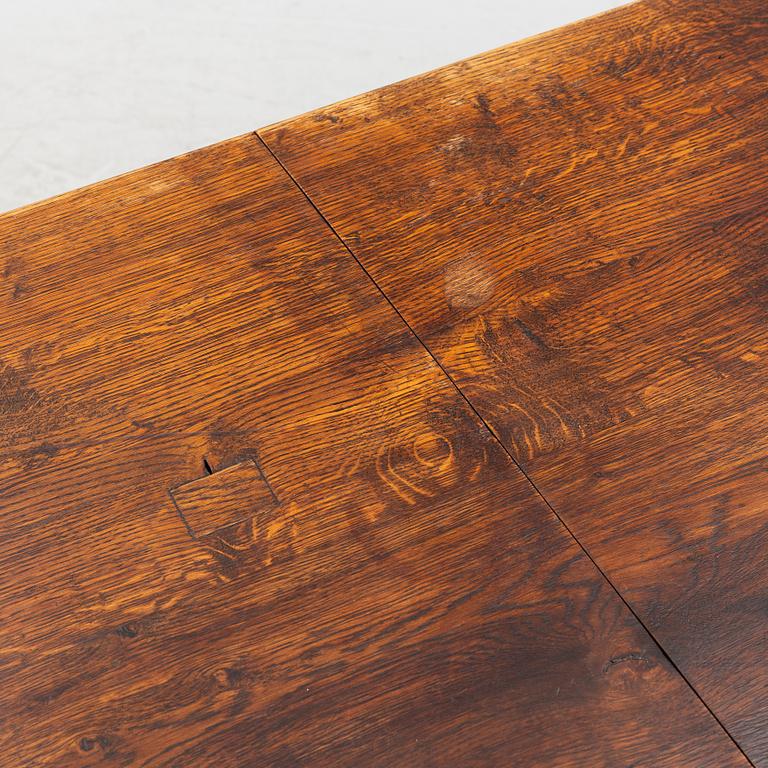 An oak dining table, Baroque early 18th century and Baroque style 19th/20th century.